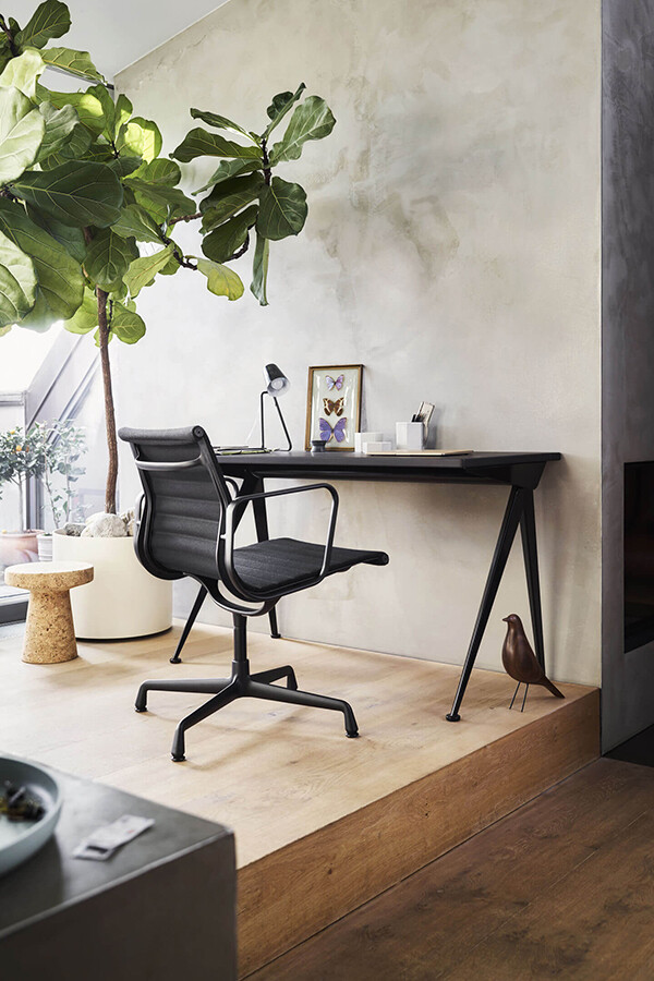 Black Vitra Eames EA 108 Aluminium Office Chair used at a desk