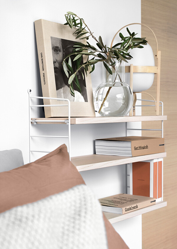 The String Pocket next to a bed