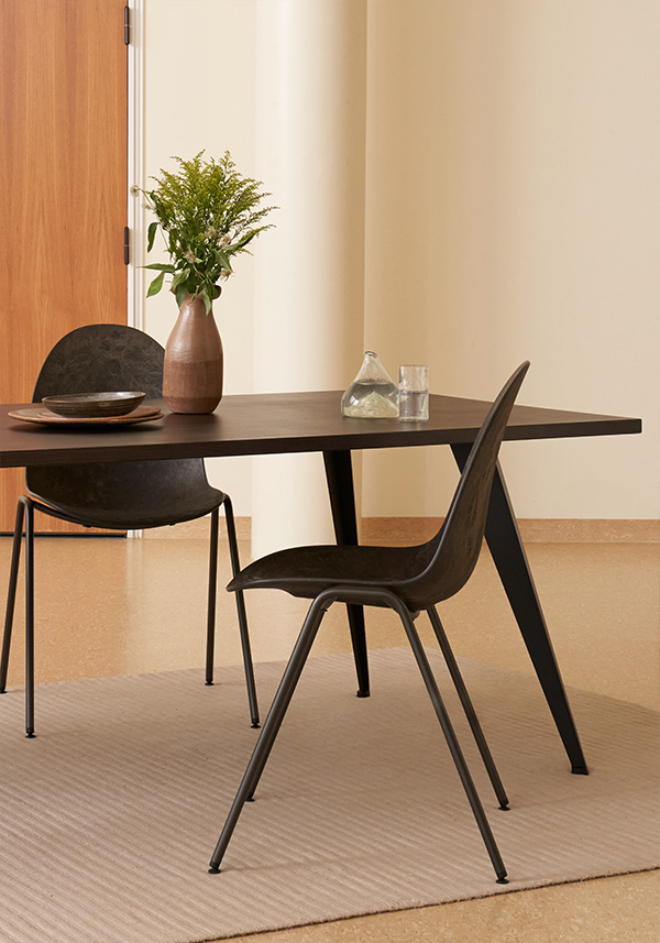 Two Mater Eternity Sidechairs around a black dinner table