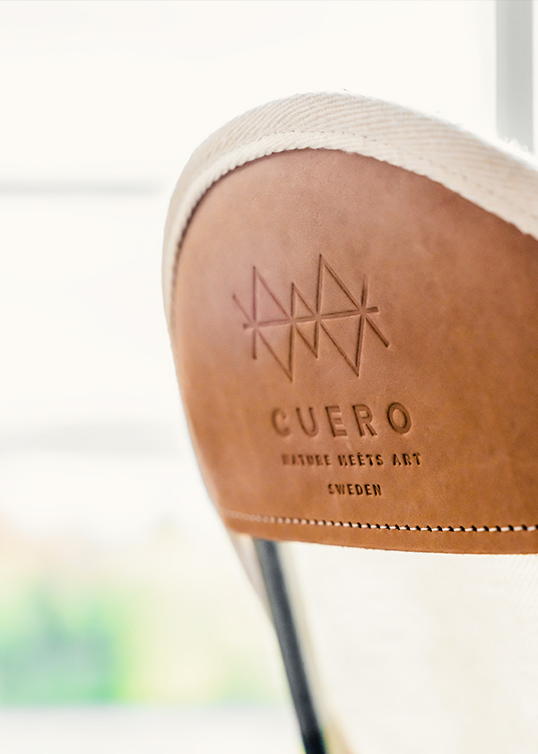 Close up detail of the Cuero design stamp on canvas mariposa chair