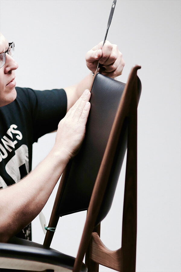 A chieftain chair being upholstered