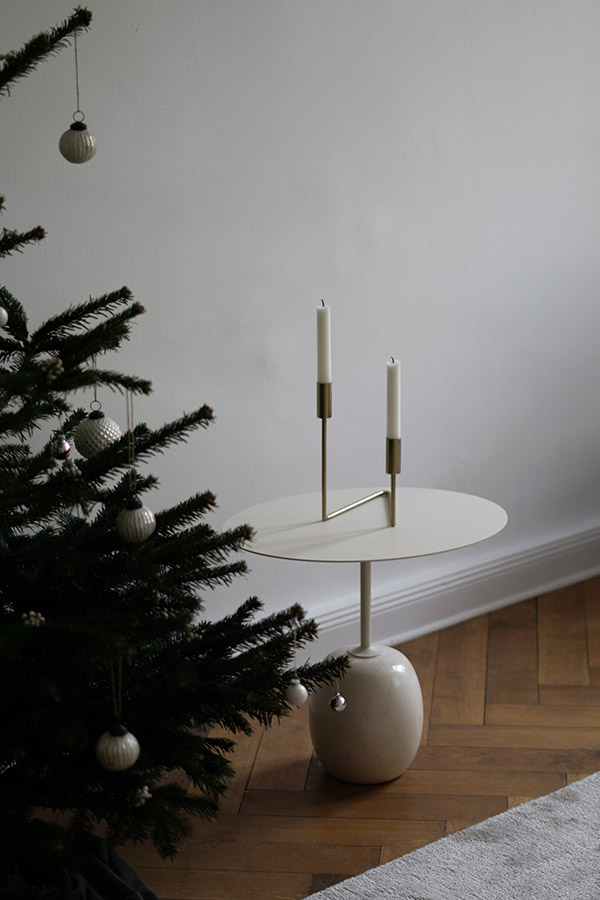 A close up of the &tradition lato table next to a christmas tree