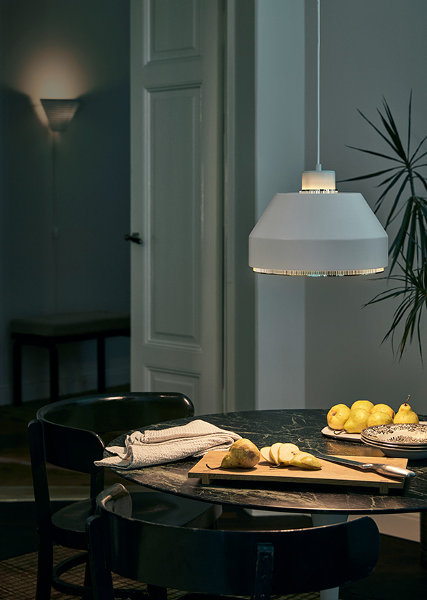 An Artek AMA500 Pendant above a dining table
