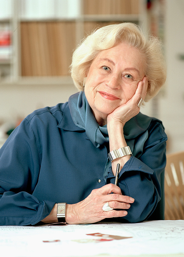 Nanna Ditzel in a blue shirt looking at the camera