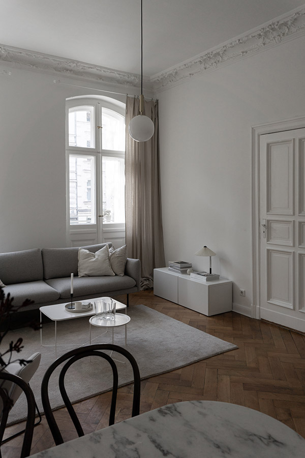 Inside Rebecca Goddard's minimal living room with grand window