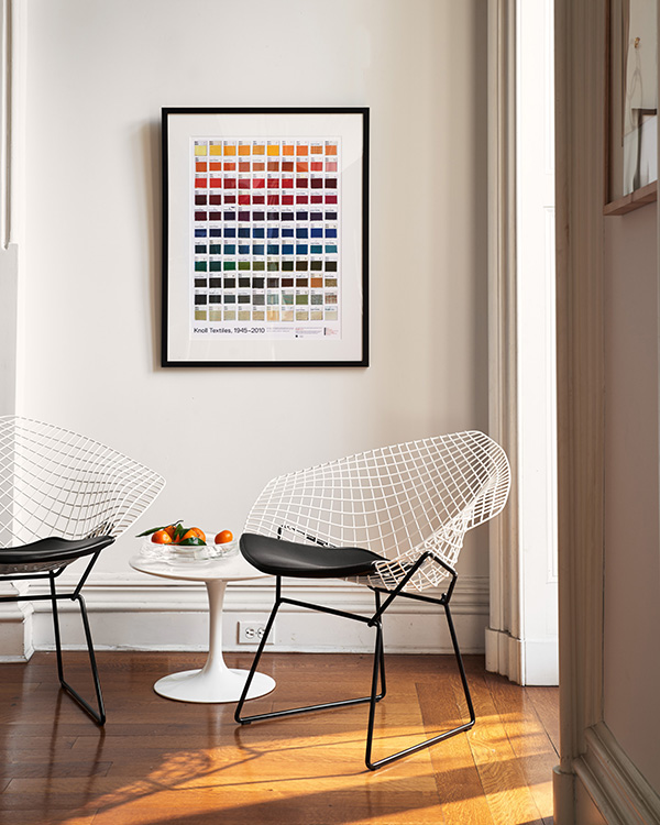 2 Knoll Diamond Chairs underneath bright artwork