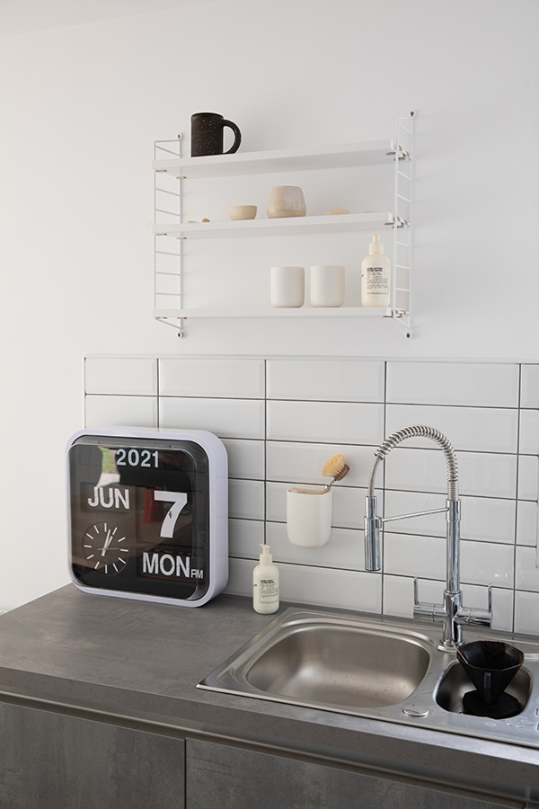 White String Pocket Shelving used above the sink in Adam's kitchen