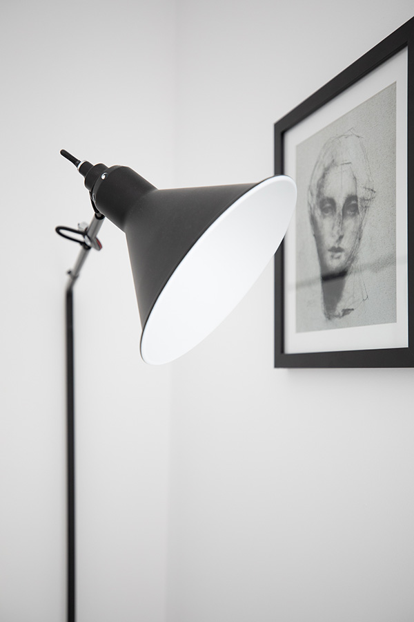 A close up of the DCW Lamp Gras Wall Light