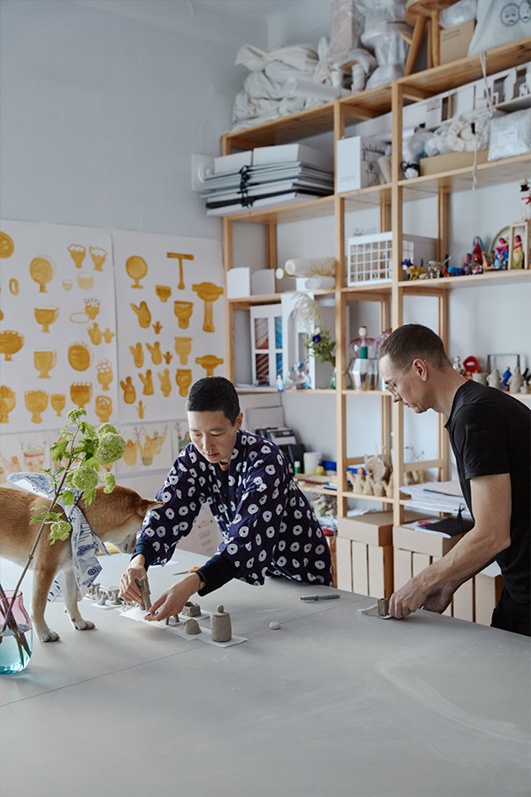 Aamu Song and Johan Olin with their dog in their studio