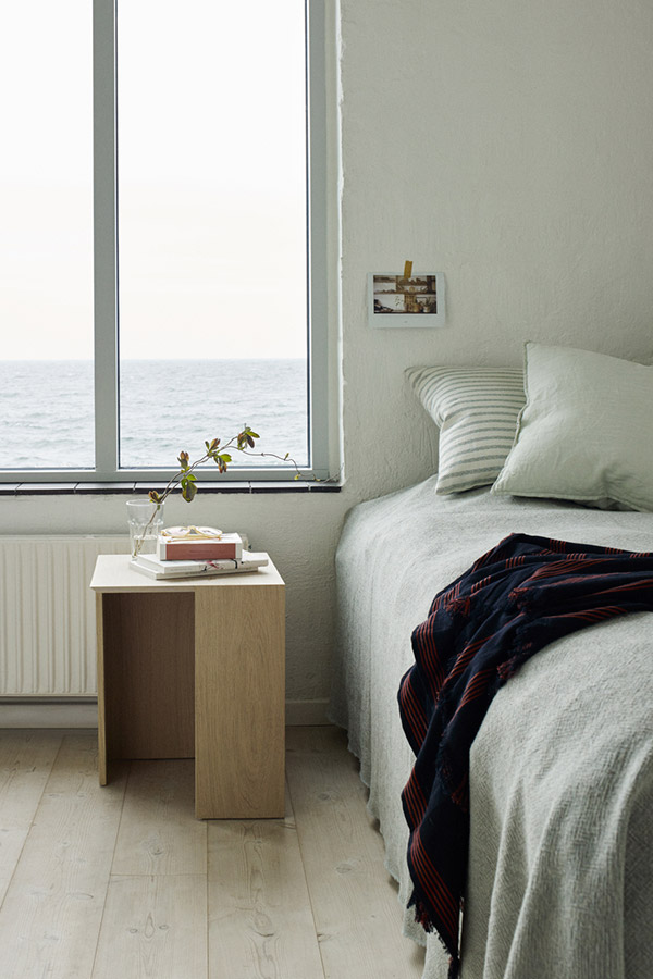 Skagerak Building Table used as a bedside table in a minimal bedroom
