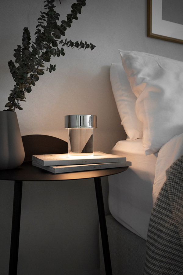Flos Last Order Table Lamp beside a bed