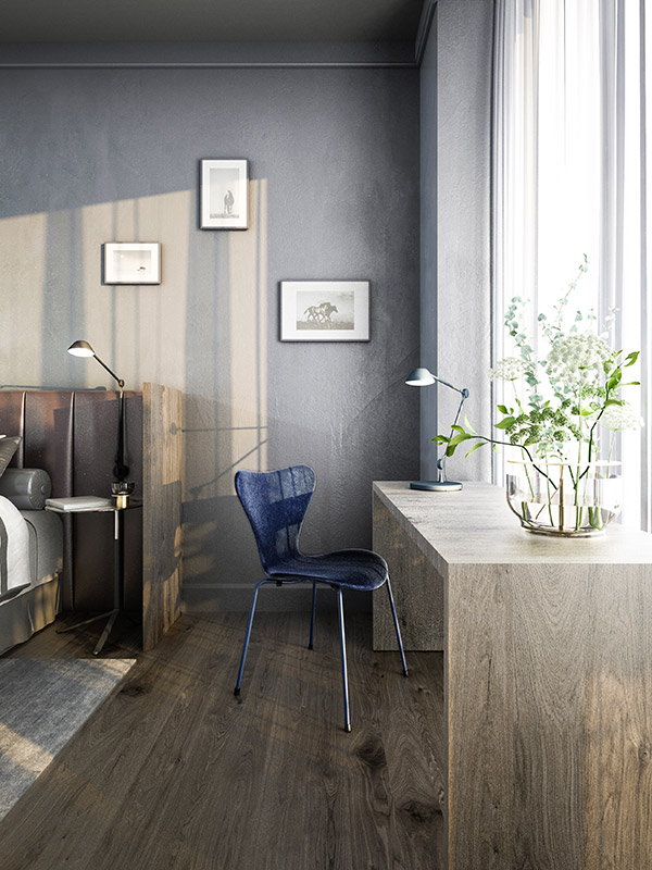 A hotel room with the Fritz Hansen Series 7 chair at a desk