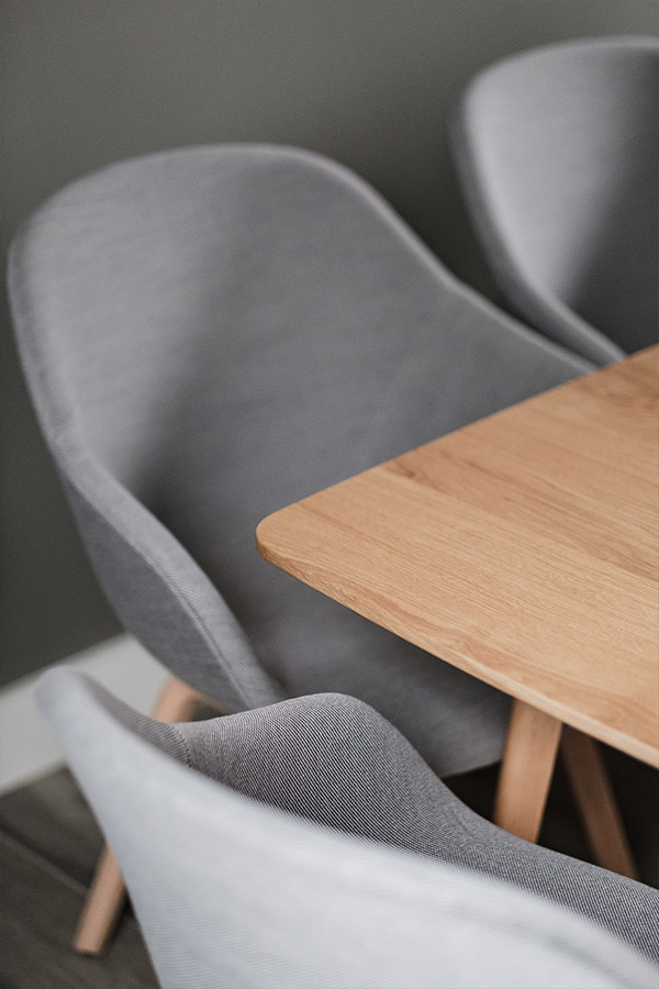 A close up of HAY AAC 123 Chairs around a wooden table