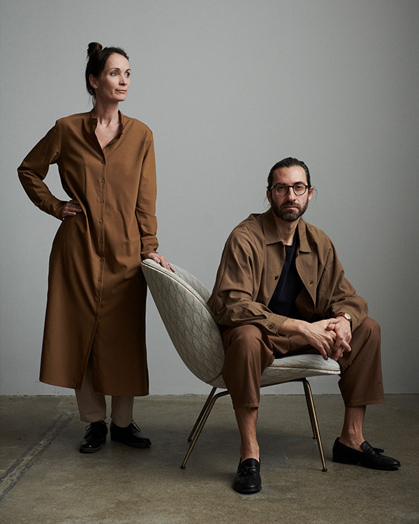 Design duo GamFratesi sitting on the Gubi Beetle lounge chair