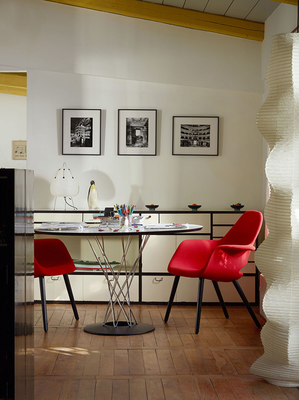 The Vitra Organic Chair in red fabric with Noguchi Dining Table