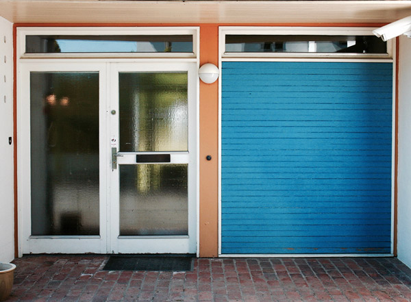 The front door and blue garage door at Finn Juhl's House