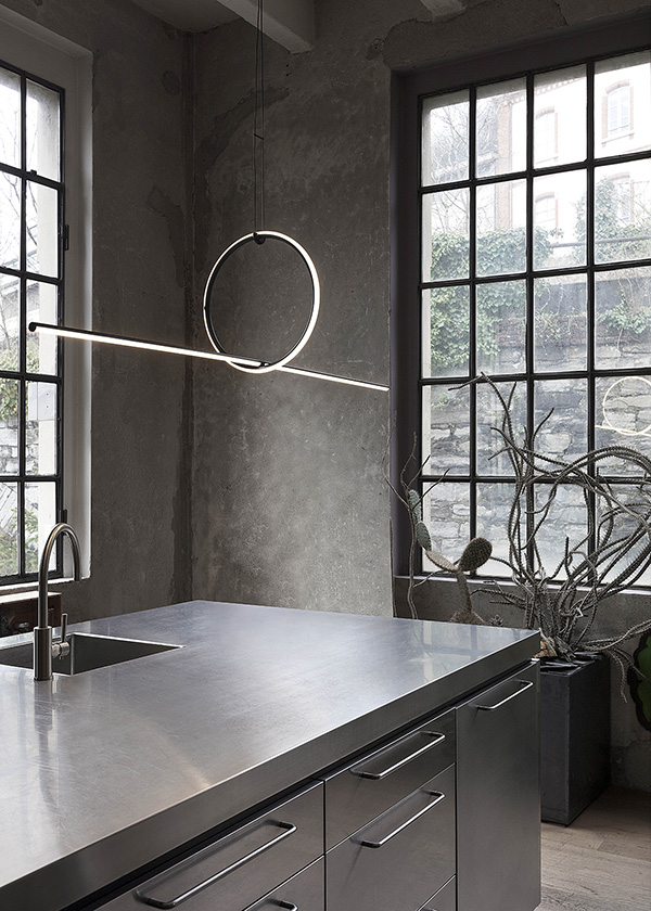 A Flos Arrangements pendant above a kitchen counter