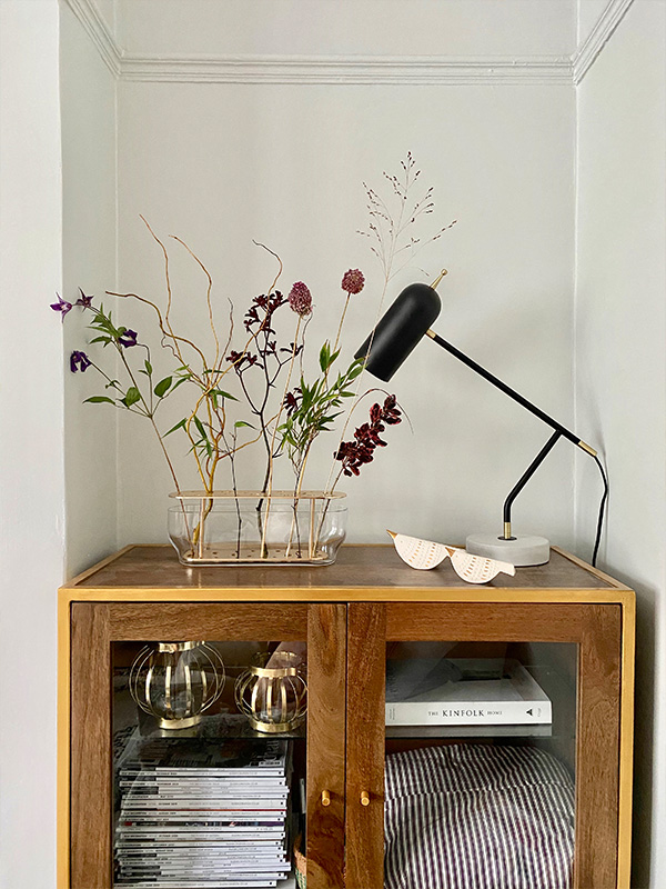 Fritz Hansen Ikebana Vase on a wooden cabinet in Heather Milner's home