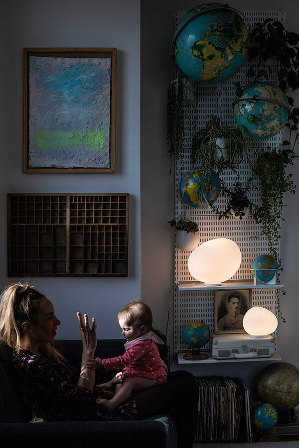Two Foscarini Gregg Lamps on shelves next to globes