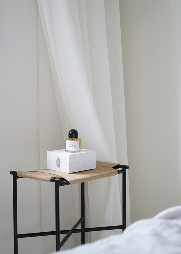 Skagerak Collection Vent Stool used as a bedside table
