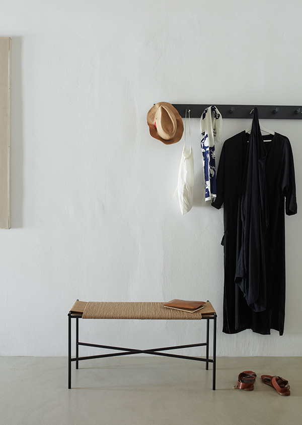 Skagerak Collection Vent Bench next to some wall hooks