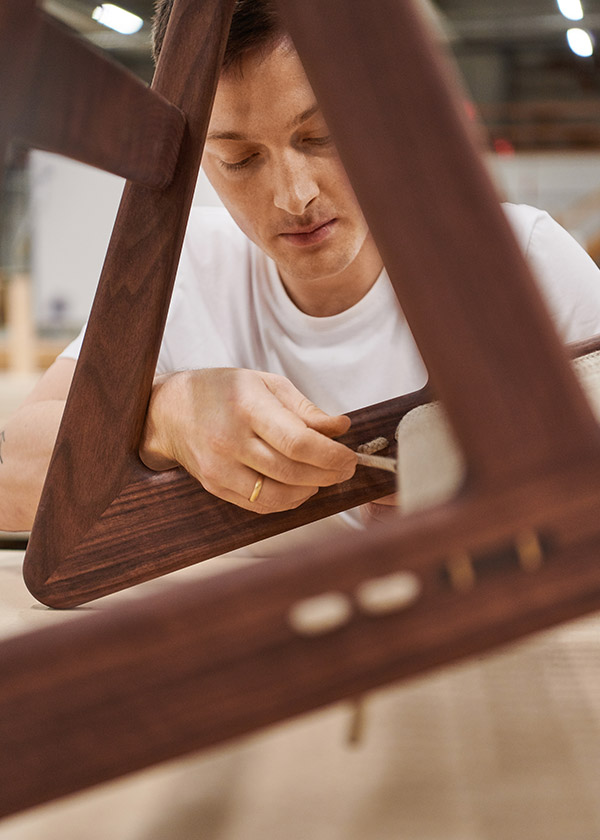 Mathias Steen Rasmussen threading rope through the Gubi MR01 Initial Chair