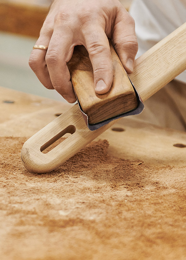 Sanding a part of the Gubi MR01 Initial Chair