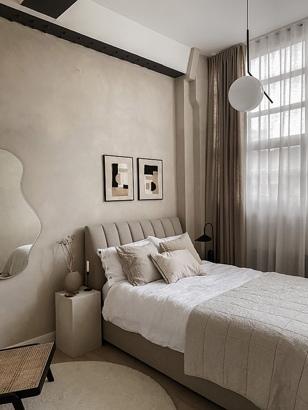 Neutral bedroom featuring the Flos IC pendant and a Ferm Living Arum Table Lamp and Pond Mirror