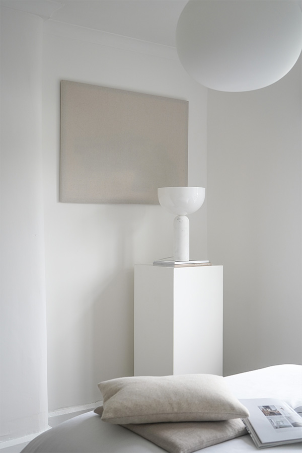 New Works Kizu Table Lamp on a white plinth