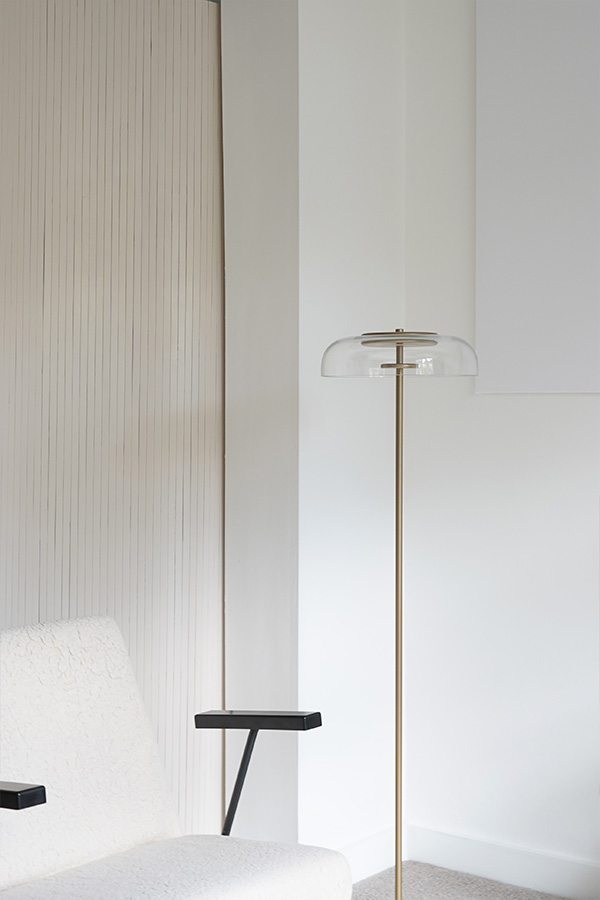 Nuura Blossi Floor Lamp next to white armchair