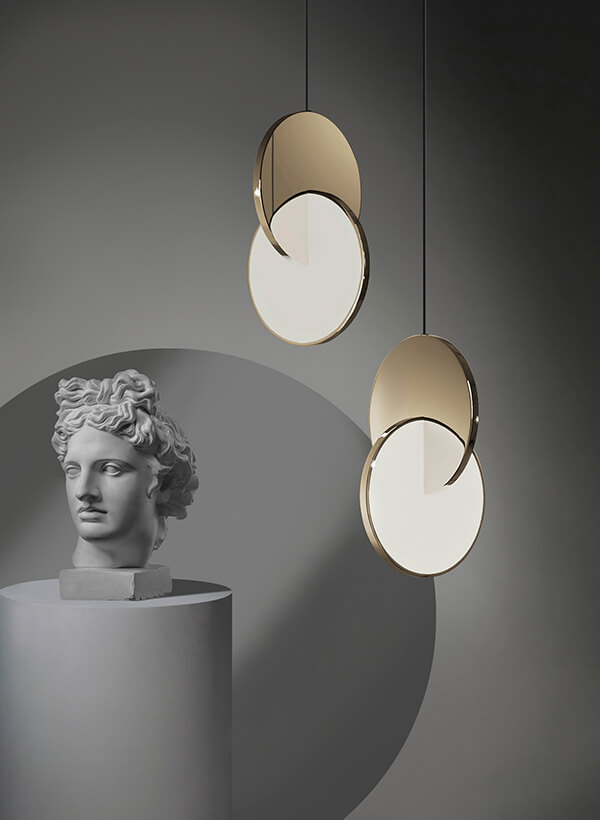 Lee Broom Eclipse Pendant Light next to a Greek bust