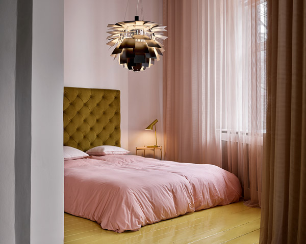 Louis Poulsen Artichoke Pendant and AJ Table Lamp in a pink bedroom