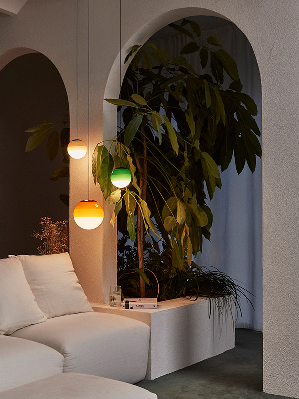 Three Marset Dipping Pendants above a sofa