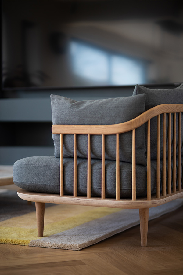 The wooden spindles at the side of the &Tradition Fly Sofa