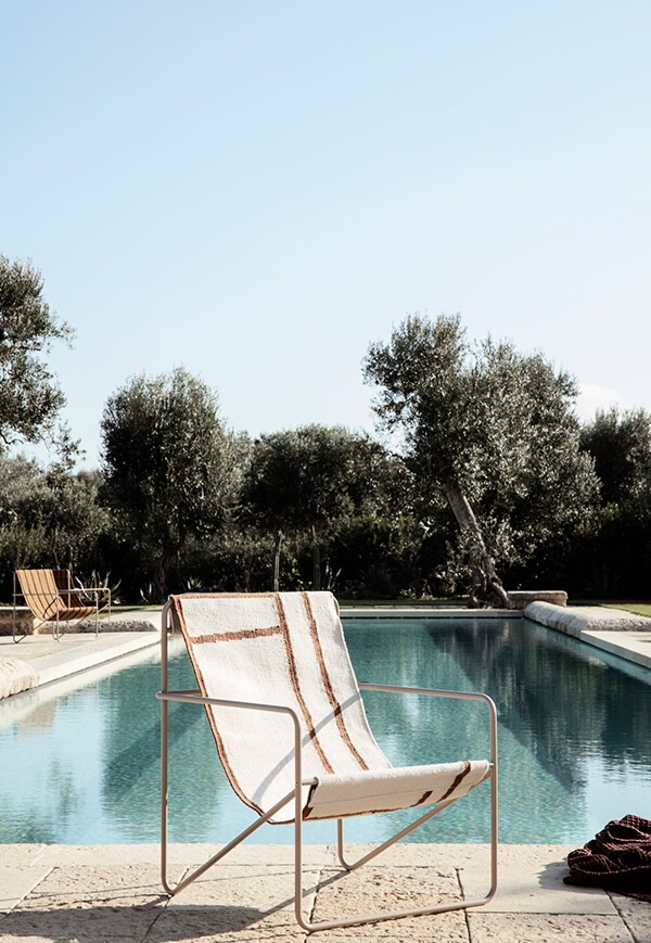 Ferm Living Desert Chair by a pool