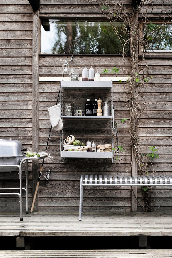 String outdoor shelving system filled with BBQ food