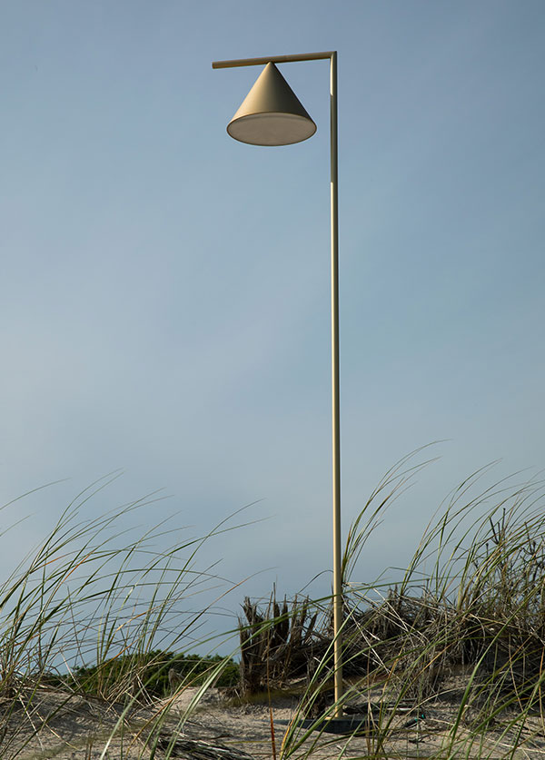 A Flos Captain Flint outdoor floor lamp on a sand dune