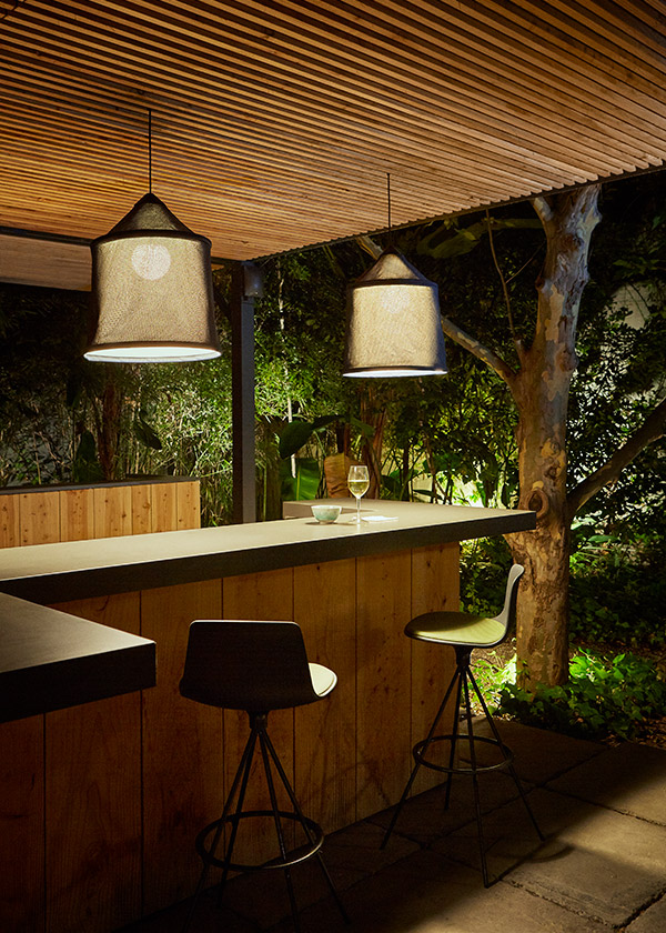 2 Marset Jaima Outdoor Pendant Lights above a bar
