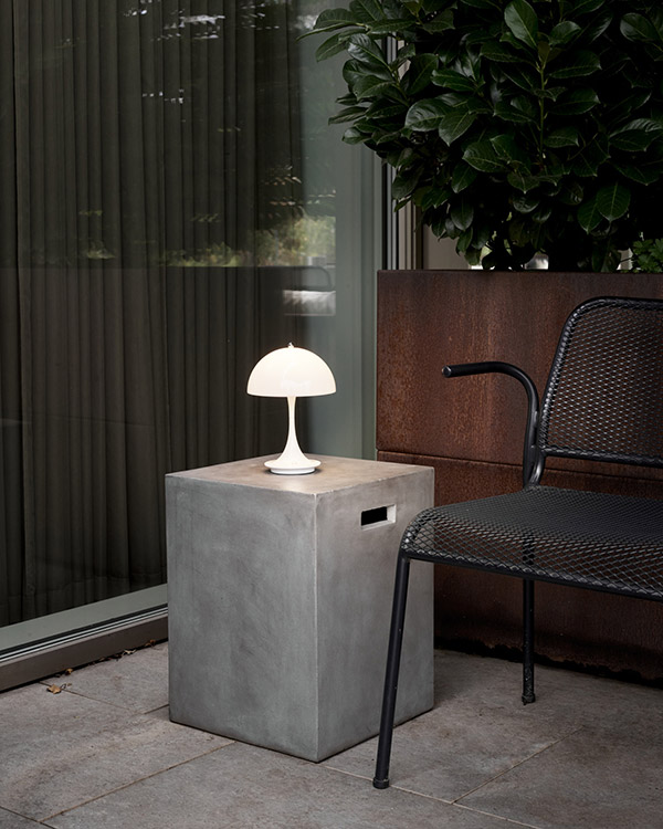 Louis Poulsen Panthella 160 Portable on a concrete garden side table