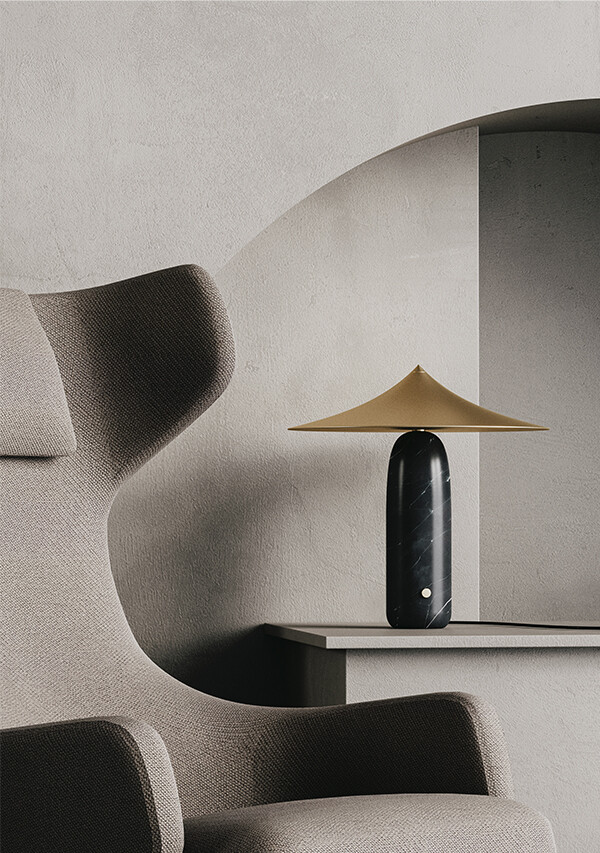Aromas Kine Table Lamp next to a lounge chair
