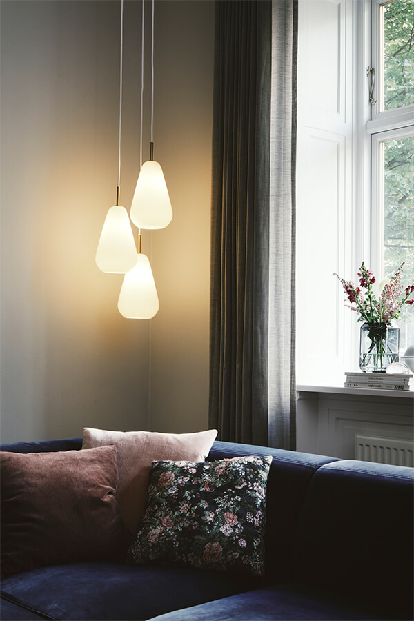 Cluster of 3 Nuura Anoli Pendants create a warm glow