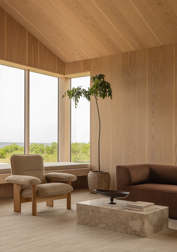 A Scandi and minimalist living space, with the Audo Copenhagen Brasilia Lounge Chair & Low Plinth