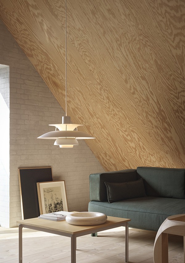 Louis Poulsen PH 5 Monochrome Pendant Light in a Living Room setting, above a coffee table