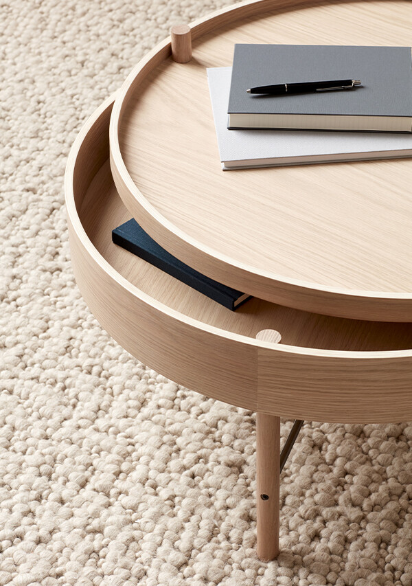 A close-up of the Audo Copenhagen Turning Table slightly opened