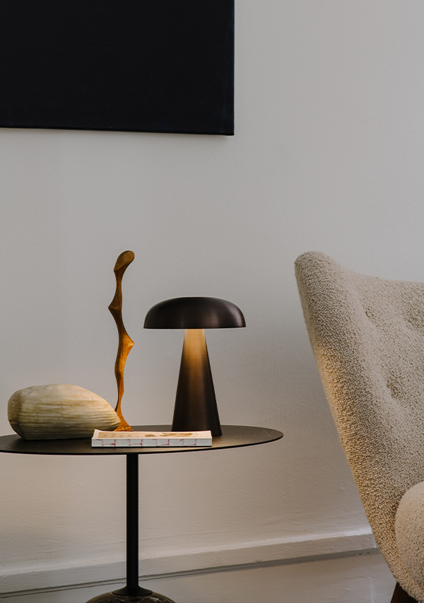 &Tradition SC53 Como Portable Table Lamp on top of the &Tradition Lato Side Table and next to the &Tradition VB1 Little Petra Lounge Chair