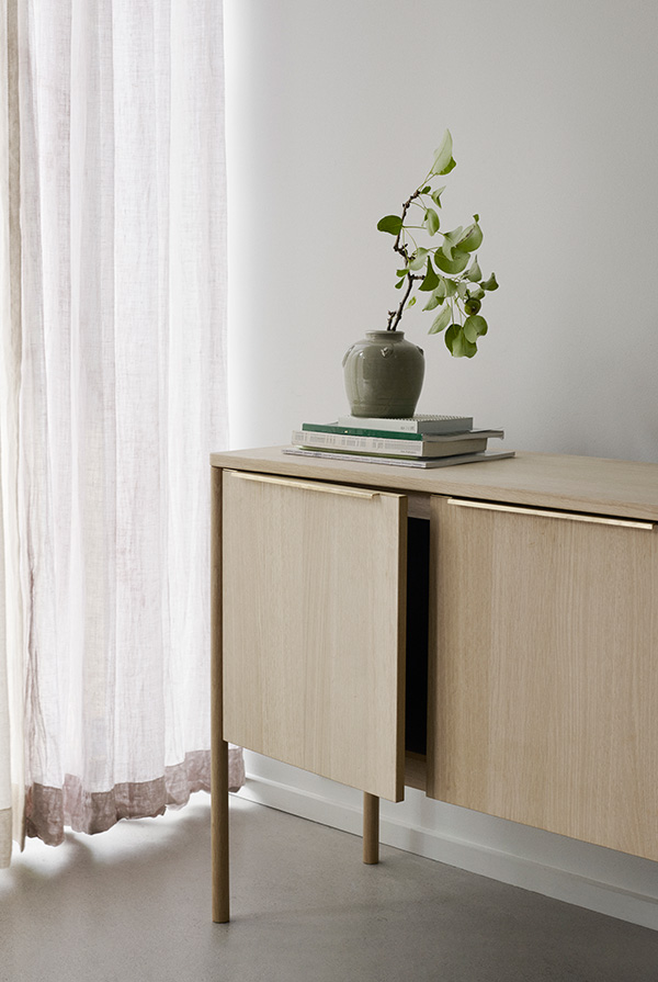 Skagerak Collection Jut Cabinet in a minimal home by a window