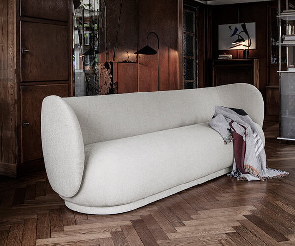 Off-white Ferm Living Rico Sofa in a dark wood interior