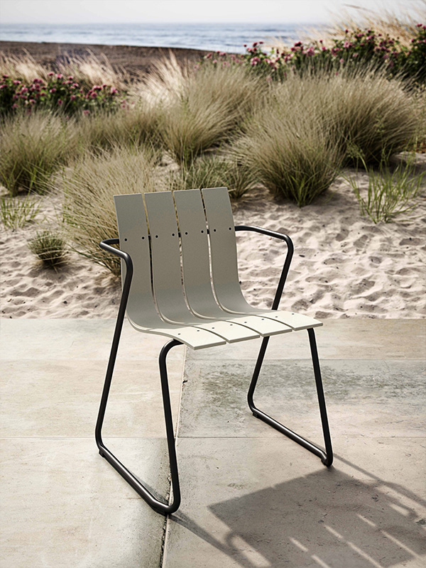 Mater Ocean chair on a patio next to sand dunes