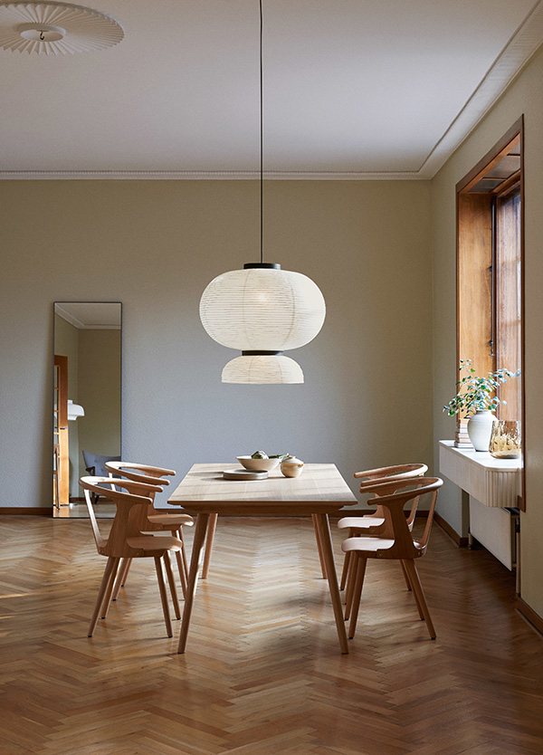 Scandinavian style dining room featuring &Tradition In Between Chairs and a Formakami pendant light