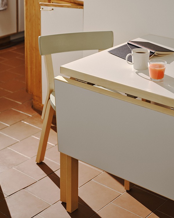 Detail of the Artek Aalto Foldable Table with the table folded inwards